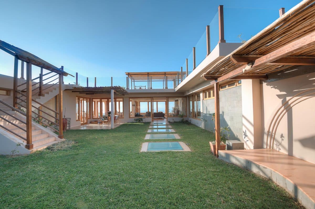 La Maison Bleue Naivasha — courtyard enclosed by timber walkways and stairs