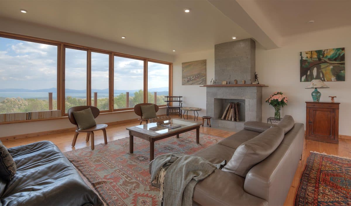 La Maison Bleue Naivasha — open living room with patterned rugs and floor-to-ceiling windows