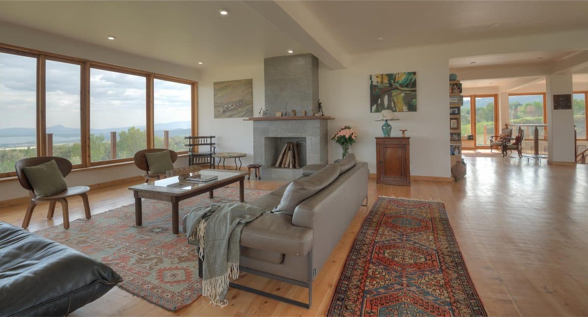 La Maison Bleue Naivasha — sunlit living room with traditional rugs and valley light