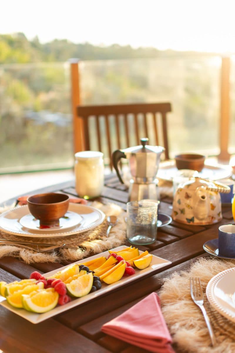 La Maison Bleue Naivasha — terrace place setting with wooden bowl and espresso pot