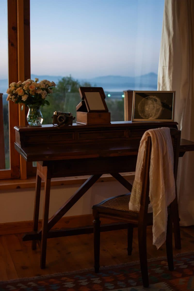 La Maison Bleue Naivasha — study corner framed by a large twilight window