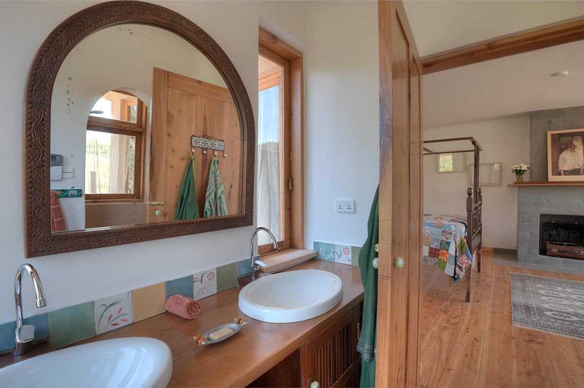 La Maison Bleue Naivasha — bathroom doorway looking through to a bedroom fireplace