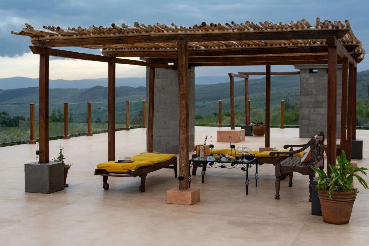 La Maison Bleue Naivasha — lounge chairs under the pergola with valley views