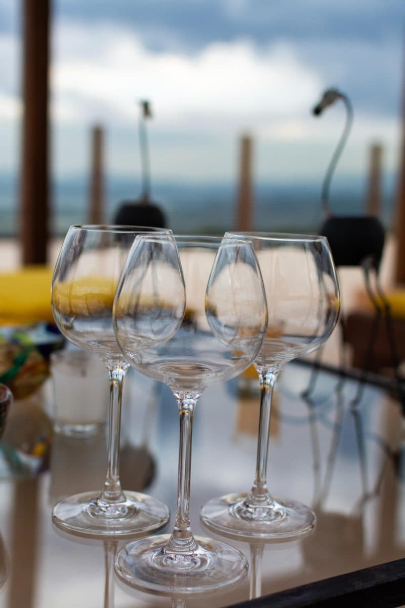 La Maison Bleue Naivasha — empty wine glasses on a glass terrace table