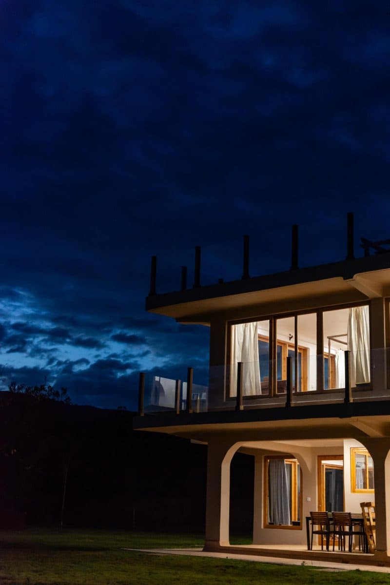La Maison Bleue Naivasha — lit corner of the glass façade at night