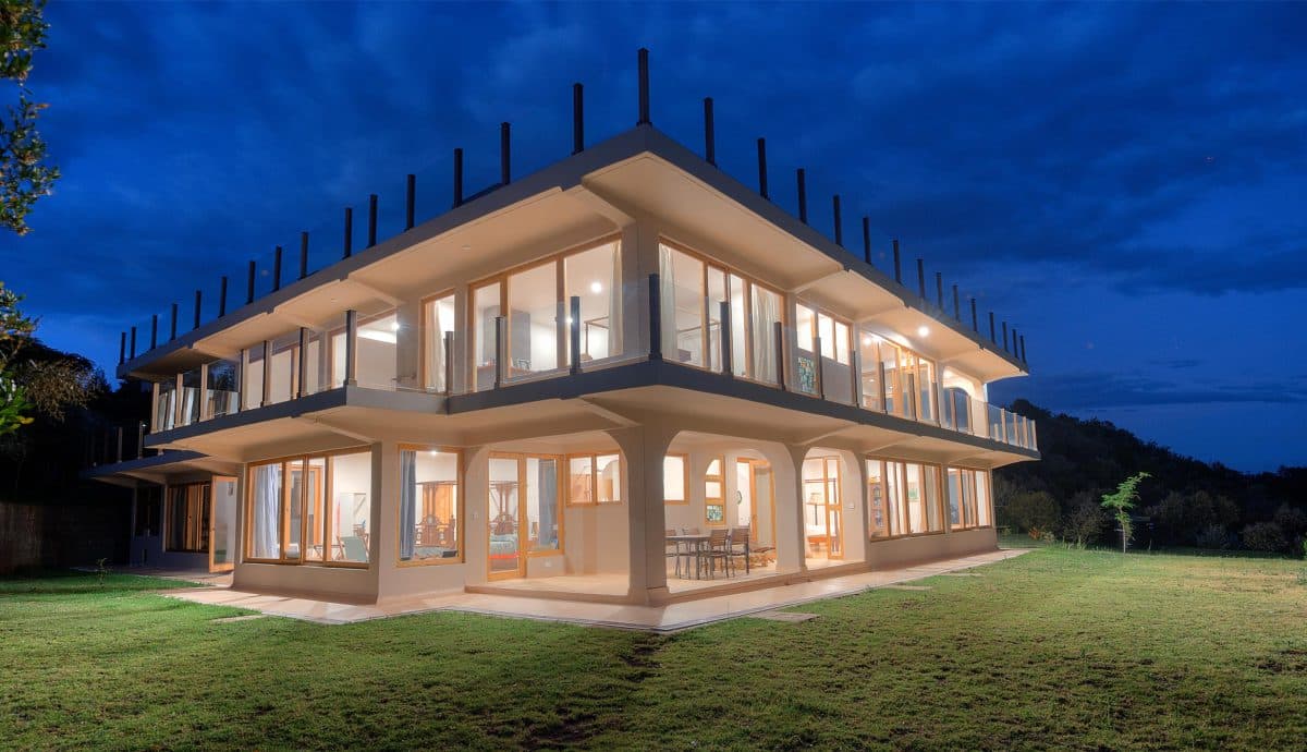 La Maison Bleue Naivasha — full length of the illuminated house after dark